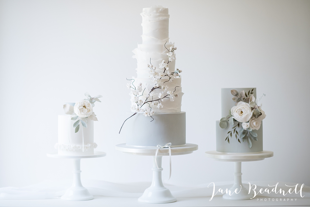 three wedding cakes flower design